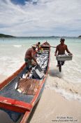 Travel photography:Fishermen landing their catch of bonito fish at Arraial-do-Cabo beach, Brazil