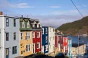 Travel photography:Row of wooden houses in St. John´s with harbour in the background, Canada