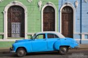 Travel photography:Cienfuegos houses with classic car, Cuba