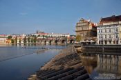 Travel photography:View of Charles Bidge with Moldau (Vltana) river, Smetana museum, and the Prague castle in the background, Czech Republic