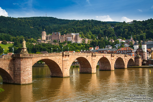 View of Heidelberg's old bridge across the Neckar River with the castle in the background