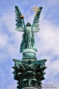 Travel photography:The archangel Gabriel atop the Millennium column on Budapest´s Heros´ Square, Hungary