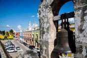 Travel photography:View of Campeche from the city walls with alarm bell, Mexico