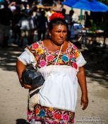 Travel photography:Woman in Mayan dress in Chichen Itza, Mexico
