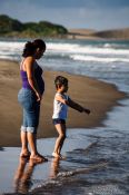 Travel photography:Mother and child at a beach near Quiahuiztlan, Mexico