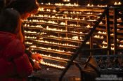 Travel photography:Lighting candles inside Stephansdom cathedral, Austria