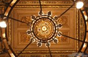 Travel photography:Ceiling and chandelier inside the Vienna State Opera, Austria