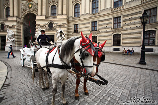 A Fiaker (horse cart for tourists) outside Vienna´s  Hofburg