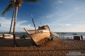 Travel photography:Boat on Praia do Forte beach at sunset, Brazil