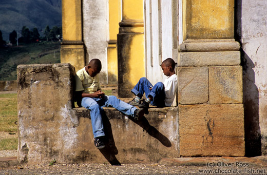 Two boys playing with their mobile phones, Ouro Preto
