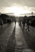 Travel photography:People on Charles Bridge (with a dark yellow tint), Czech Republic