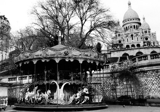 Paris Sacre Coeur basilica with carousel on Montmartre