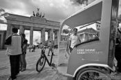 Travel photography:The Brandenburg Gate in Berlin with cycle rickshaw, Germany