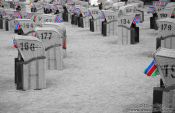 Travel photography:Tinted black and white image of beach baskets in Laboe, Germany