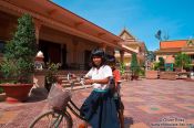 Travel photography:Kids on a bike at a buddhist monk school in Phnom Penh, Cambodia