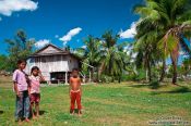 Travel photography:Children outside their home between Sihanoukville and Kampott , Cambodia