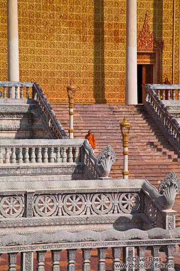 Monk descending a temple staircase at the Vipassara Dhara Buddhist Centre near Odonk (Udong)