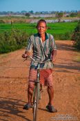 Travel photography:Man on bike near Odonk (Udong), Cambodia
