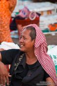 Travel photography:Man with Khmer head scarf at the Battambang central market people , Cambodia