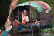Travel photography:Boy on a boat near the Tonle Sap lake, Cambodia