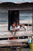 Travel photography:Kids in their floating home near Tonle Sap lake, Cambodia
