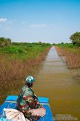 Travel photography:Navigating through a narrow gap in the vegetation near Tonle Sap lake, Cambodia