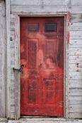 Travel photography:Red door of a shack in St. John´s harbour, Canada