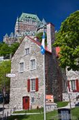 Travel photography:Old house in Quebec with Château Frontenac castle in the background, Canada