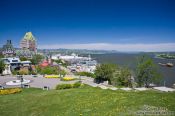Travel photography:The Château Frontenac castle in Quebec with Terrasse Dufferin promenade and Saint Lawrence river, Canada