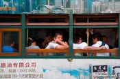 Travel photography:Passengers in a tram in downtown Hong Kong, China