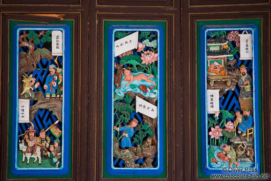 Ornately carved and painted window shutters at the Longevity Pavillion in Lijiang´s Black Dragon Pool park