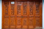 Travel photography:Ornate carvings on a wooden door in Dali, China