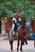 Travel photography:Lijiang man on horse, China