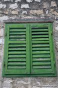 Travel photography:Green window shutters in Sibenik, Croatia