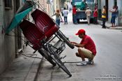 Travel photography:Repairing the cycle rickshaw in Havana, Cuba