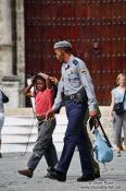 Travel photography:Boy with policeman in Old Havana, Cuba