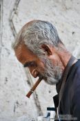 Travel photography:Man having a smoke in a public park in Havana, Cuba