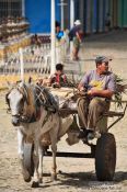 Travel photography:Man on horse carriage in Trinidad, Cuba