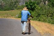 Travel photography:Man pushing his bike near Viñales, Cuba