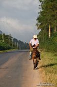 Travel photography:Man on horse in near Viñales, Cuba