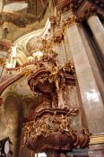 Travel photography:Pulpit in Prague`s St. Nicolas church , Czech Republic