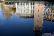 Travel photography:Reflections of houses and the Smetana museum near Charles Bridge, Czech Republic
