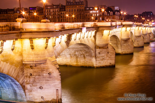 View of the Pont Neuf (new bridge) across the Seine river by night
