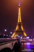 Travel photography:Paris Eiffel Tower at night with river Seine, France