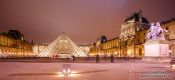 Travel photography:Paris Louvre Museum with Louis XIV statue, France