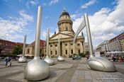 Travel photography:View of the French Dome from the Gendarmenmarkt with giant musical notes, Germany