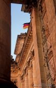 Travel photography:Reichstag facade detail with flag, Germany