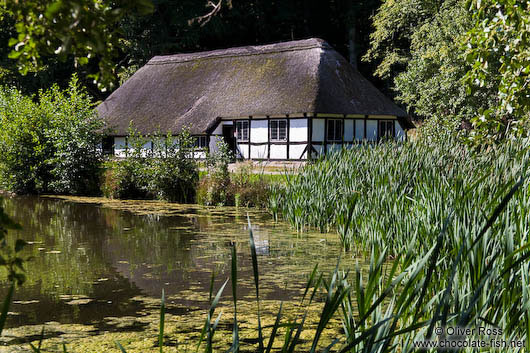 18th century half-timbered house by a lake 
