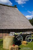 Travel photography:Typical 18th century Frisian farm house with cart, Germany