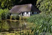 Travel photography:18th century half-timbered house by a lake , Germany